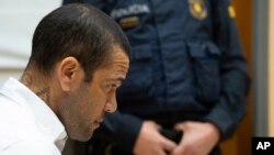 FILE - Brazilian soccer star Dani Alves sits during his trial in Barcelona, Spain, Feb. 5, 2024. Alves has been found guilty on Feb. 22, 2024 of sexually assaulting a young woman in a Barcelona nightclub.