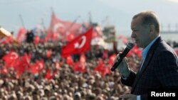 Turkish President Tayyip Erdogan addresses his supporters during a rally ahead of the May 14 presidential and parliamentary elections, in Izmir on April 29, 2023. (Turkish Presidential Press Office/ via Reuters) 