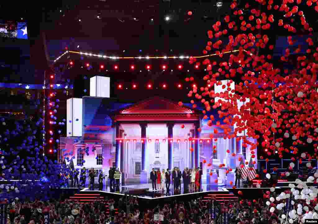 Republican presidential nominee Donald Trump is joined on stage by his wife Melania and family members as thousands of balloons drop from the ceiling after he finished giving his acceptance speech on Day 4 of the Republican National Convention at the Fiserv Forum in Milwaukee, July 18, 2024.