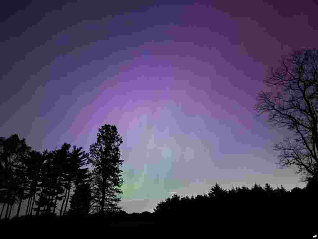 The aurora borealis, also known as the northern lights, is visible over Ann Arbor, Michigan, May, 11, 2024.