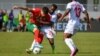 Abdessamad Ezzalzouli et Gedeon Kalulu avec Meschack Elia lors du match entre le Maroc et la RD Congo au Stade Laurent Pokou de San Pedro, le 21 janvier 2024.