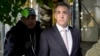 Michael Cohen leaves his apartment building on his way to Manhattan criminal court in New York, May 13, 2024.