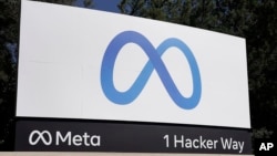 FILE - Facebook's Meta logo sign is seen at the company headquarters in Menlo Park, Calif., Oct. 28, 2021. The company said on Aug. 1, 2023, that it will ask EU-based users for consent before allowing targeted advertising on its social networks. 