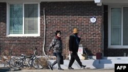 South Korean residents walk through a village of Yeonpyeong island, near the 'northern limit line' sea boundary with North Korea, Jan. 6, 2024. 