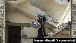X influencers falsely claimed this photograph "Mother" taken by Hassan Ghaedi in Homs, Syria shows a Palestinian woman in Gaza. 