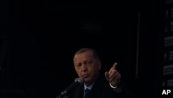 FILE - People's Alliance's presidential candidate Recep Tayyip Erdogan speaks to his supporters during an election rally in Istanbul, Turkey, May 12, 2023.