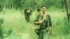 Nate Thayer, walks along with the Khmer Rouge soldiers in the Khmer Rouge's controlled area in 1990. (Facebook/Nate Thayer)