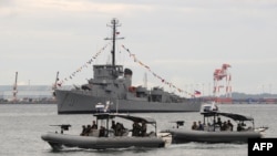 A Philippine Navy special operations group on board speed boats patrols off Subic Bay, facing the South China Sea, August 6, 2013.