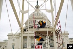 Construction continues on the inaugural platform in preparation for the swearing-in ceremonies for President-elect Donald Trump on the Capitol steps in Washington, Dec. 8, 2016.