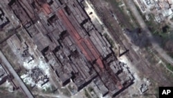 This satellite image provided by Maxar Technologies shows a closer view of eastern end of Azovstal steel plant in Mariupol, in territory under the government of the Donetsk People's Republic, eastern Ukraine, Thursday, May 12, 2022.