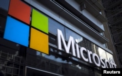 FILE - A Microsoft logo is seen on an office building in New York City, July 28, 2015.
