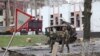 Ukrainian troops patrol Borodyanka, Ukraine, days after retaking the town from Russian soldiers, April 6, 2022. (Heather Murdock/VOA)
