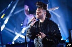 Recording artist The Weeknd performs at the 2015 Billboard Hot 100 Music Festival at Nikon at Jones Beach Theater, Aug. 22, 2015, in Wantagh, New York.