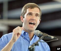 FILE - Kentucky Attorney General Andy Beshear speaks at the Fancy Farm Picnic in Fancy Farm, Ky., Aug. 1, 2015.