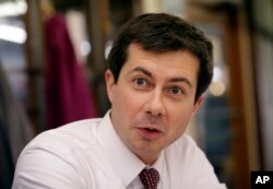 FILE - Pete Buttigieg, mayor of South Bend, Ind., talks with a reporter in South Bend, Jan. 10, 2019.