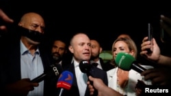 Malta's former Prime Minister Joseph Muscat speaks to the press outside the Law Courts on the day of the arraignment over corruption charges in connection with a hospital privatisation scandal dating back to 2015, in Valletta, Malta May 28, 2024. 