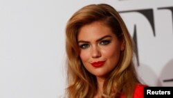 U.S. actress Kate Upton arrives on the red carpet to promote the movie "The Other Woman" in Munich, April 7, 2014.