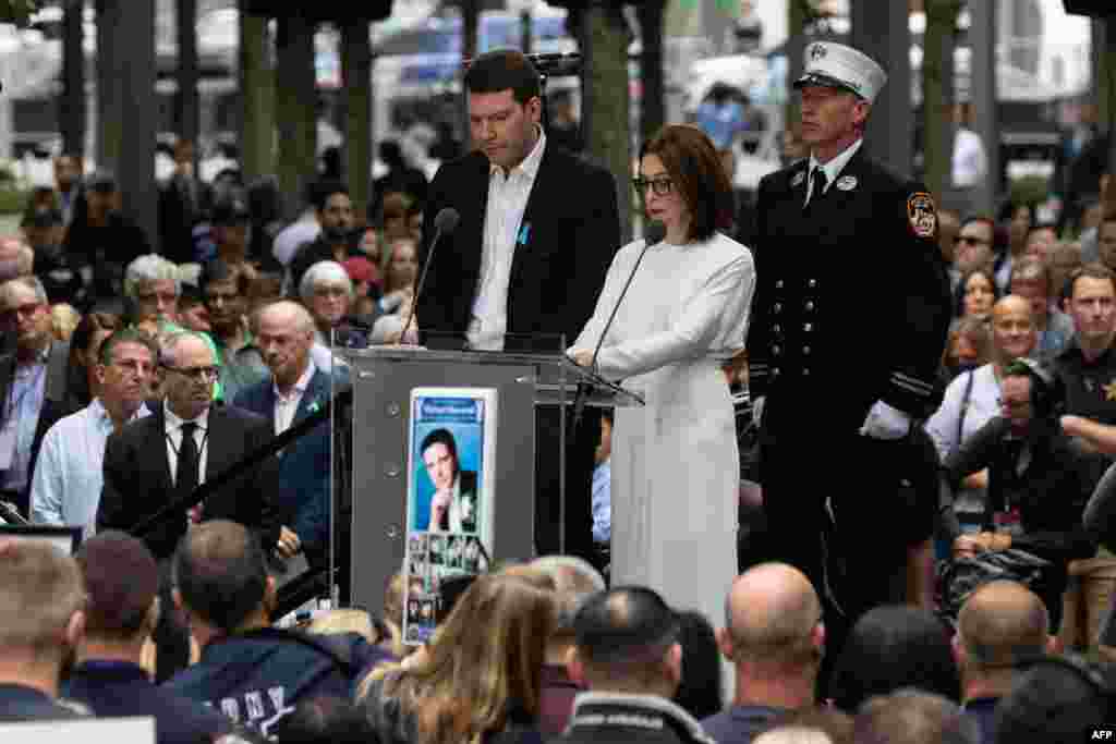 Names of victims are read during a remembrance ceremony at the 9/11 Memorial in New York City, Sept. 11, 2022, on the 21st anniversary of the attacks on the World Trade Center, Pentagon, and Shanksville, Pennsylvania.
