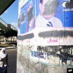 The defacement is being blamed on security forces., Other opposition candidates have also seen their campaign posters marred in Alexandria, Egypt, 22 Nov 2010