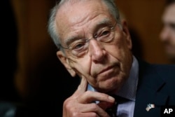 FILE - Senate Judiciary Committee Chairman Chuck Grassley of Iowa chairs a meeting of the committee on Capitol Hill in Washington, Sept, 28, 2018.