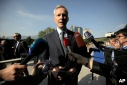 FILE - French Finance Minister Bruno Le Maire speaks at the National Palace of Culture in Sofia, Bulgaria, April 27, 2018.