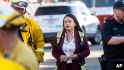 FILE - Oakland Mayor Sheng Thao visits emergency responders battling the Keller Fire in Oakland, Calif., Oct. 18, 2024. 