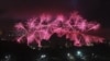 FILE - Fireworks explode behind Sydney's Opera House during New Year's celebrations, Australia, Dec. 31, 2013.