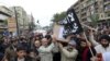 Lebanese Sunnis march through the northern city of Tripoli carry the coffins of Lebanese militants killed in Syria last December. Sunni militants from Lebanon have been fighting with rebels trying to oust Syria's Assad government. 
