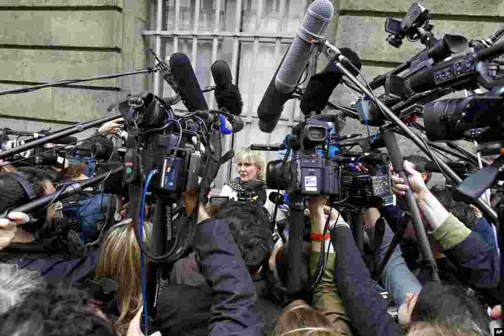 French UMP conservative party member and former minister Nadine Morano, center, addresses reporters outside the French National Assembly in Paris. The leader of former French President Nicolas Sarkozy's conservative party is resigning amid a scandal over financing of Sarkozy's losing 2012 presidential campaign.