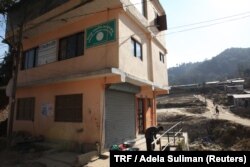 The earthquake-worn Tribeni community library stands on the hillside of the village of Bhimdhunga, Nepal, Feb.9, 2018.