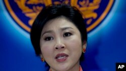 Thailand's Prime Minister Yingluck Shinawatra talks to media during a press conference in Bangkok, Thailand, May 7, 2014.