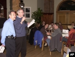 Professor John Cohen, with guest lecturer Dan Bessesen, at a Mini Med School gathering to discuss the science of medicine with members of the community.