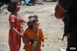 Islamic State's return in Tenek caused so much chaos and terror, that some parents lost track of their children. Here, children are pictured in Mosul, Iraq, July 2, 2017. (H. Murdock/VOA)