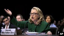 FILE - Then secretary of state Hillary Clinton testifies on Capitol Hill in Washington, Jan. 23, 2013, before the Senate Foreign Relations Committee hearing on the deadly Sept. 11, 2012, attack on the U.S. diplomatic mission in Benghazi, Libya.
