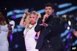 Robin Thicke performs at IHeartRadio Music Festival, day 1, Sept, 20, 2013 in Las Vegas.