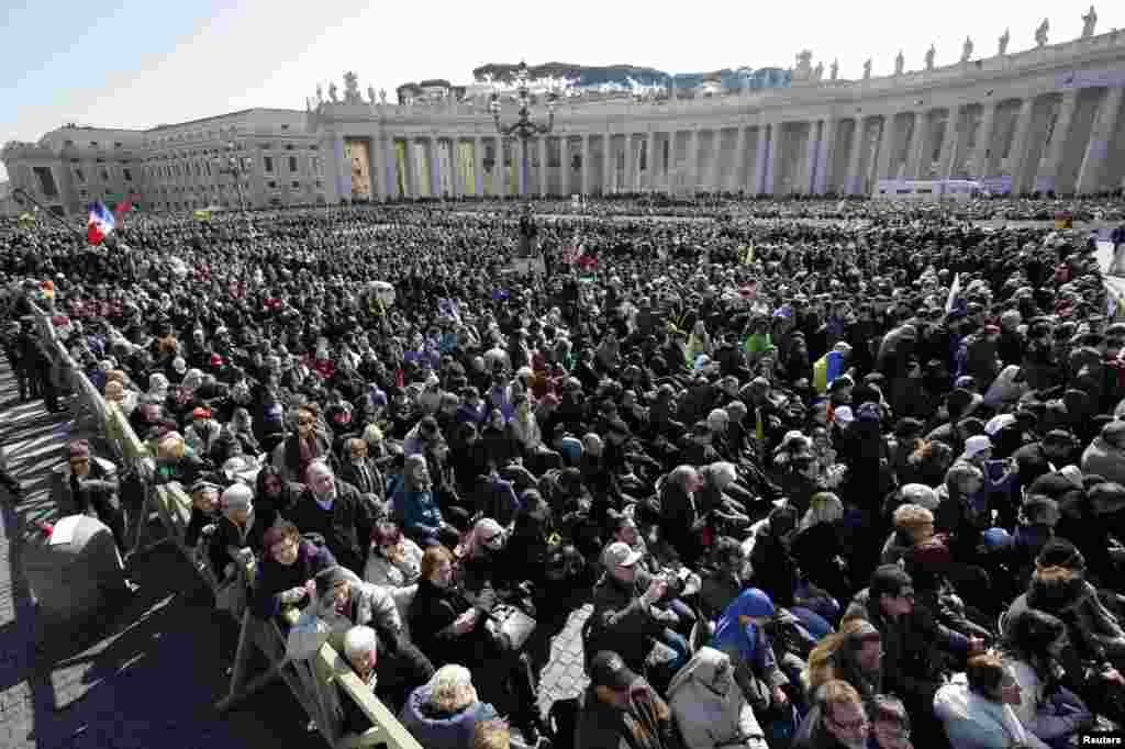 The crowd listens to Pope Benedict in St. Peter's Square during his last general audience at the Vatican, Feb. 27, 2013.