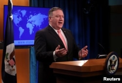 FILE - U.S. Secretary of State Mike Pompeo speaks to reporters during a news briefing at the State Department in Washington, Oct. 23, 2018.