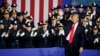 President Donald Trump waves after speaking to law enforcement officials on the street gang MS-13, July 28, 2017, in Brentwood, New York. 