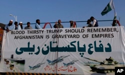 The Pakistan Defense Council, an alliance of hard-line Islamist religious leaders and politicians, attend an anti-U.S rally in Islamabad, Pakistan, Aug. 27, 2017. Pakistan's political, religious and military leaders have rejected President Donald Trump's allegation that Islamabad is harboring militants who battle U.S. forces in Afghanistan.