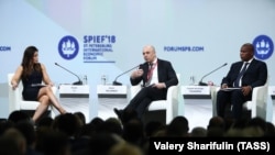 TV Anchor Susan Li, Russia's First Deputy Prime Minister and Finance Minister Anton Siluanov, and Central African Republic President Faustin Archange Touadera (L-R) at the opening of the 2018 St Petersburg International Economic Forum