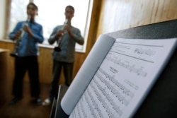 FILE - In this May 11, 2010 file photo, students learn to play music at the Afgan National Institute of Music, ANIM, in Kabul, Afghanistan.