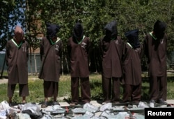 FILE - Insurgents suspected of being from the Haqqani network are presented to the media at the National Directorate of Security (NDS) headquarters in Kabul May 30, 2013.