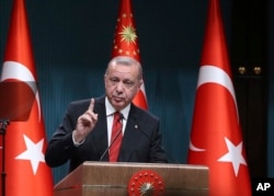 FILE - Turkey's President Recep Tayyip Erdogan speaks during a ceremony at the presidential palace, in Ankara, Turkey, May 6, 2019.