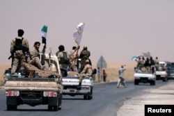 Syrian Democratic Forces (SDF) fighters head to Raqqa, Syria, June 6, 2017.