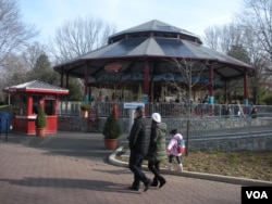 Solar panels on the roof power the National Zoo's Conservation Carousel, one of only two worldwide which runs on sunlight. (VOA/J. Taboh)