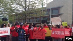 Protesters take part in a march to demand efforts increase to find kidnapped girls in Nigeria, in front of the Nigerian embassy in Washington, May 6, 2014. (Chelsea Pescador/VOA)