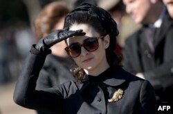 FILE - Actress Natalie Portman, in the role of Jacqueline Kennedy, is seen outside the White House while filming a scene for the movie "Jackie" on Pennsylvania Avenue February 28, 2016 in Washington, DC.