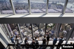 Visitors to the newly opened One World Observatory in New York, May 29, 2015.