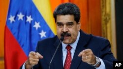 Venezuelan President Nicolas Maduro gives a press conference at Miraflores presidential palace in Caracas, Venezuela, Jan. 25, 2019.