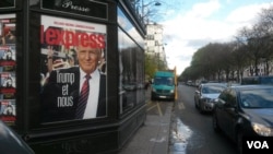 A billboard on a Paris newsstand underscoring how deeply the US elections have resonated in France, Paris, Nov. 18, 2016. (L. Bryant/VOA)